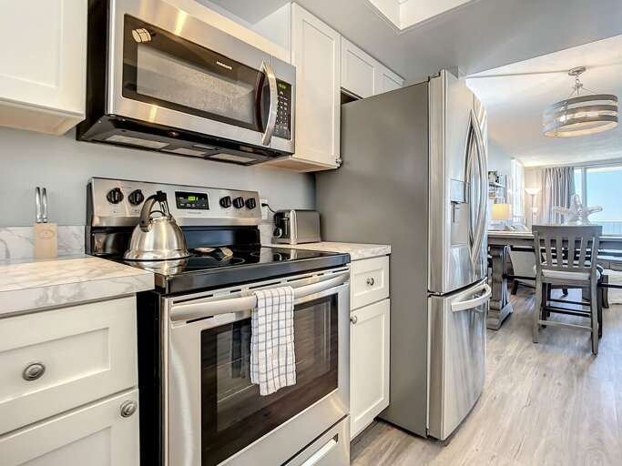 Flat top stove and microwave. Full size fridge.