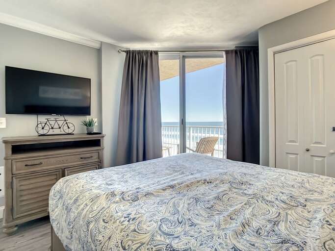 Mounted TV. Access to balcony.