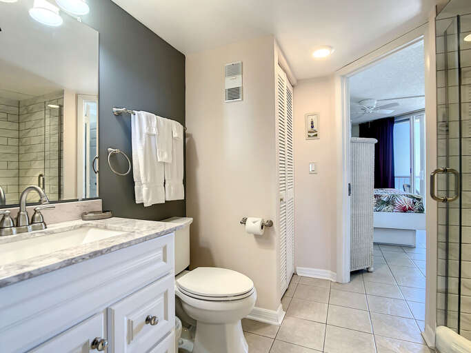 Vanity with storage and walk in shower. Vanity with storage and walk in shower.