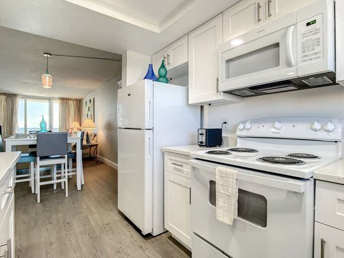 Stove with microwave above. Full size fridge. Stove with microwave above. Full size fridge.