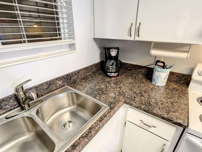 Double sink. Storage and full-size coffee maker.