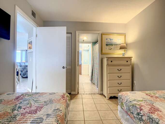 Dresser for storage. Access to the guest bathroom.