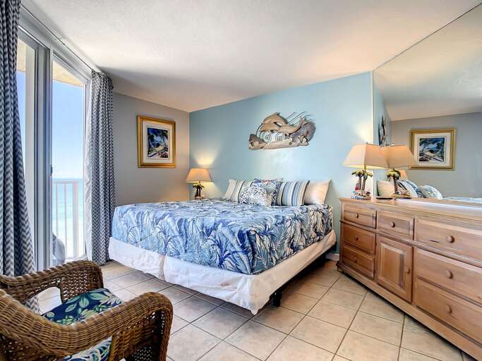 King size bed with access to the balcony.