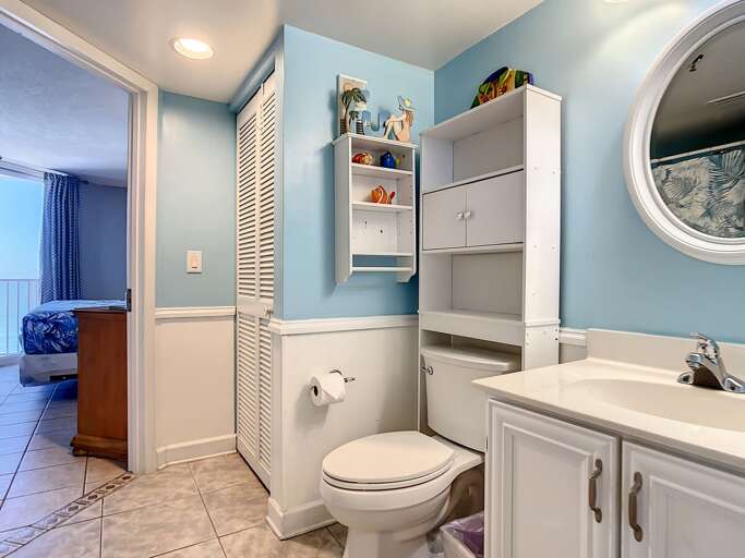 Vanity and closet for storage. Access to the master bedroom