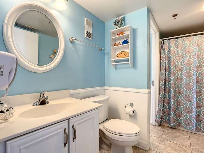 Vanity with storage. Shower tub combination.