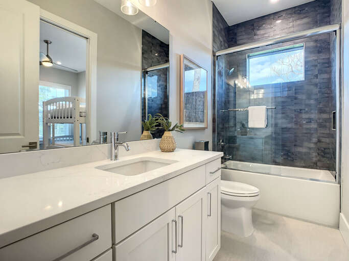 Our full-size bathroom boasts a shower-tub combo, offering the perfect spot to rejuvenate after a day of adventures.