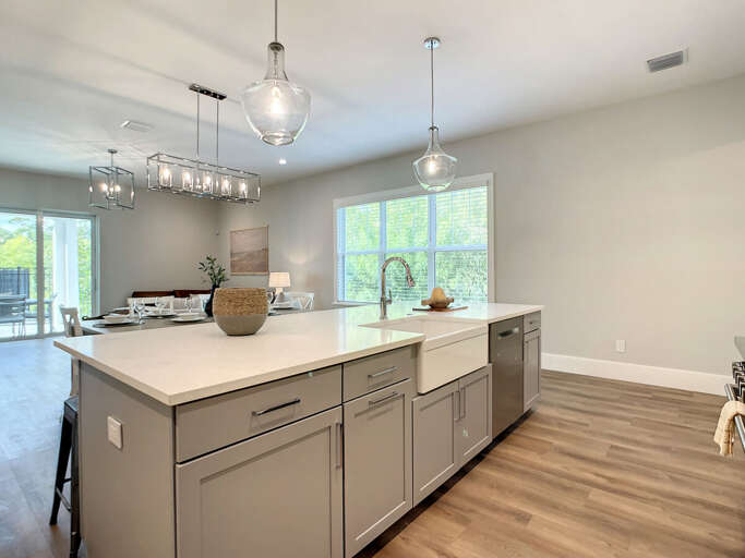 Our open kitchen with a spacious island is the heart of your vacation home, perfect for family gatherings.