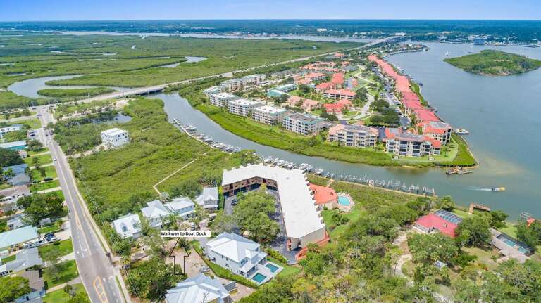 Take in the stunning aerial vista of our 3-bed, 3-bath oasis with a private pool, nestled near the tranquil canal.