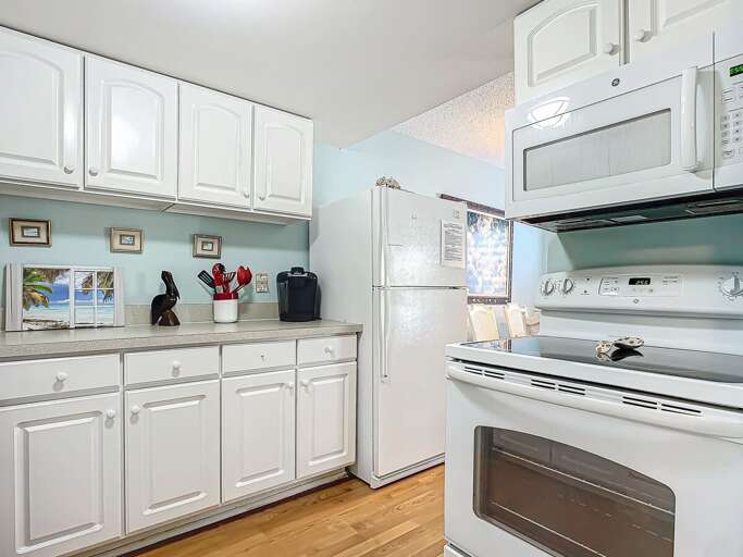 A sleek kitchen featuring modern appliances, perfect for cooking and enjoying homemade meals. A sleek kitchen featuring modern appliances, perfect for cooking and enjoying homemade meals.