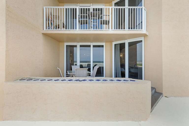 Relax and dine on the spacious outdoor patio with a direct view of the ocean, perfect for enjoying meals and fresh air by the sea.