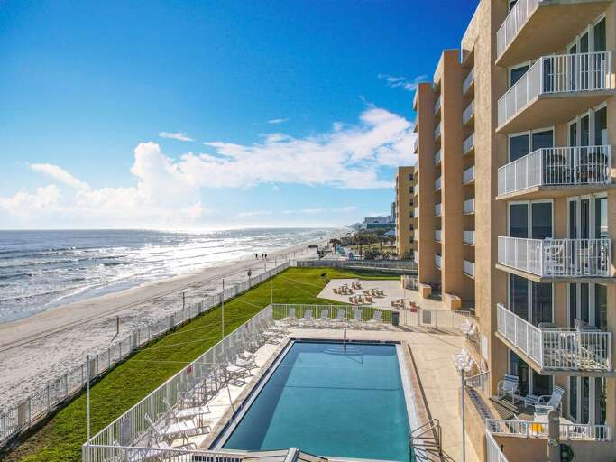 Soak up the sun by the oceanfront pool, just steps from the beach, offering a perfect blend of relaxation and coastal charm.
