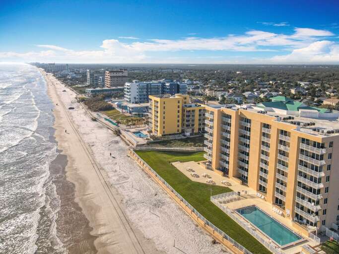 Wake up to breathtaking ocean views and golden sand beaches in this perfect coastal retreat, featuring a pool and relaxing amenities.