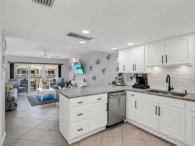 Bright kitchen flows into a cozy living space—perfect for relaxing or entertaining. Bright kitchen flows into a cozy living space—perfect for relaxing or entertaining.