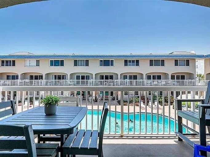 Dine or unwind with sunny views overlooking the sparkling pool. Dine or unwind with sunny views overlooking the sparkling pool.