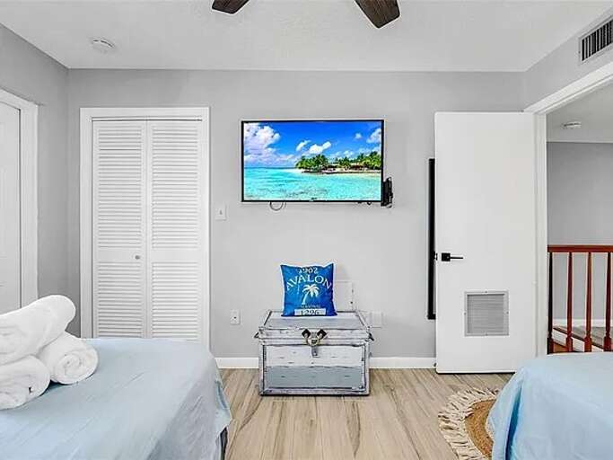 Enjoy this nautical-themed bedroom with a Smart TV—perfect for streaming your favorite shows after a day at the beach! Enjoy this nautical-themed bedroom with a Smart TV—perfect for streaming your favorite shows after a day at the beach!