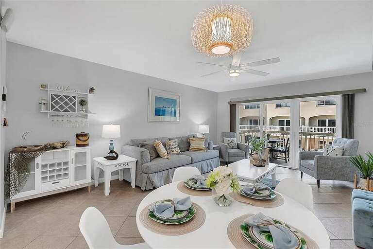 Relax in this airy, beach-themed space with comfy seating and balcony access. Relax in this airy, beach-themed space with comfy seating and balcony access.