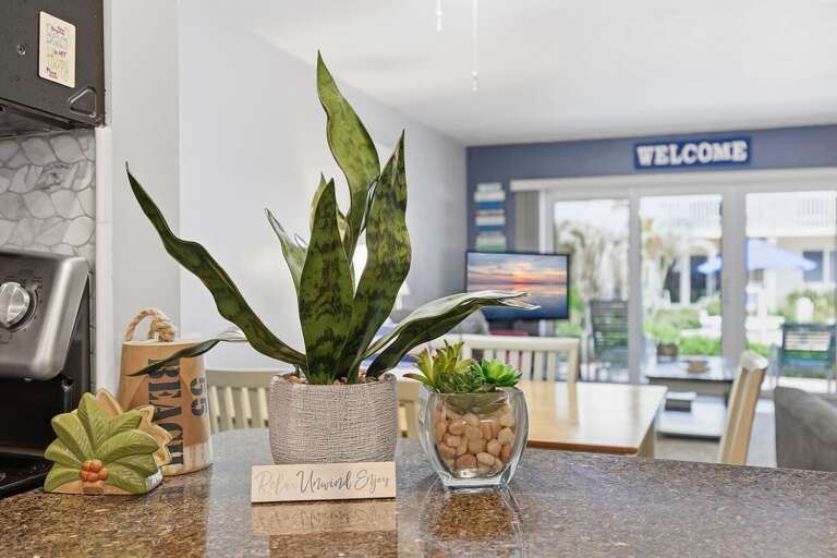 Enjoy charming coastal touches and an inviting open-concept layout in this relaxing beach condo.