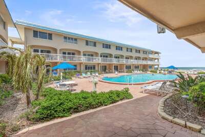 Relax at this beachfront getaway featuring a sparkling resort pool, sun loungers, tropical