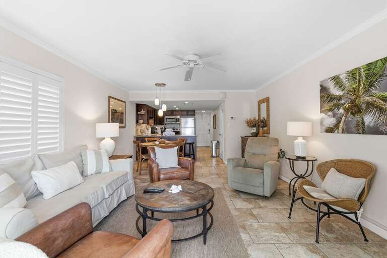 Enjoy a relaxing beach stay in this open-concept coastal condo featuring comfortable seating,