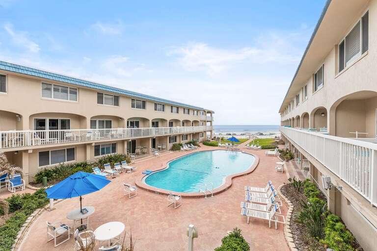Enjoy this resort-style pool area with lounge seating, coastal views, and easy beach access just steps away. The perfect beach stay for relaxing poolside and soaking up the seaside atmosphere.