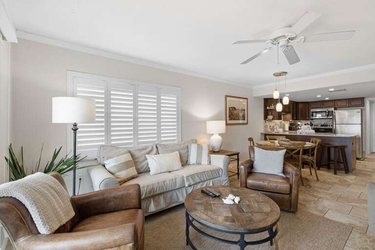 Relax in this inviting open-concept beach condo featuring cozy seating, coastal décor, and a fully equipped kitchen. The perfect beach stay for family vacations and relaxing seaside escapes.