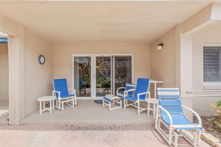 Enjoy your beach stay on this private patio with comfy lounge chairs and shaded seating. Perfect for