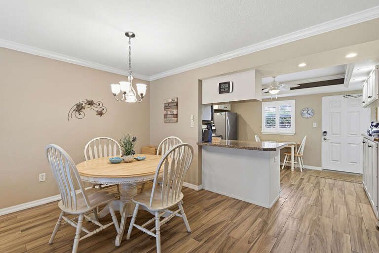 Inviting dining space with coastal charm, perfect for meals and gatherings. This beach stay features