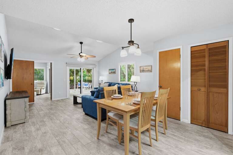 Light-filled Living Space With Dining Set, Sofa, And Sliding Door To Balcony