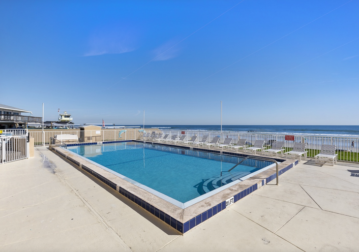 Take a refreshing dip in the oceanfront pool, just steps from the beach. Relax on poolside loungers while soaking up the sun and enjoying the perfect beach stay atmosphere.