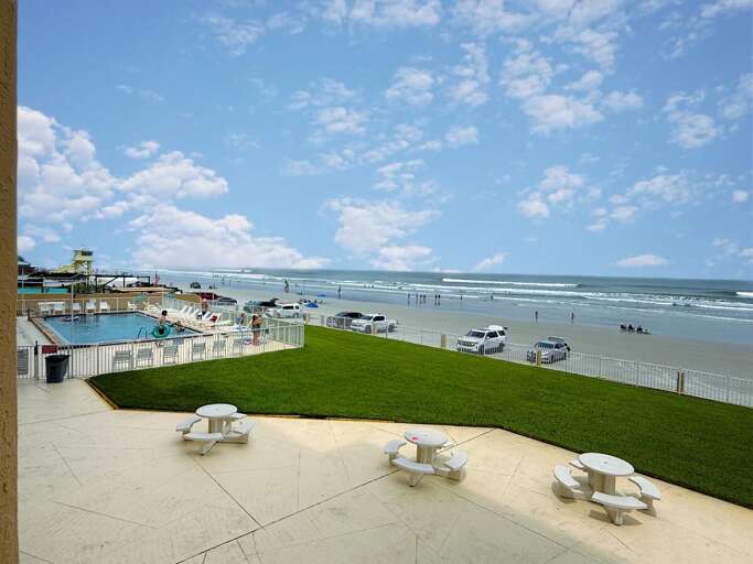 Soak up the sun at this oceanfront pool with lounge chairs, picnic tables, and direct beach access—perfect for relaxing, swimming, and enjoying a true coastal getaway.