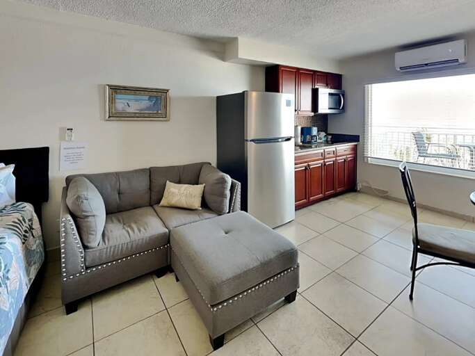 Unwind on the comfy sectional sofa or prepare a light meal in the kitchenette. This bright beachside retreat offers comfort and convenience with ocean views just outside your window. Unwind on the comfy sectional sofa or prepare a light meal in the kitchenette. This bright beachside retreat offers comfort and convenience with ocean views just outside your window.