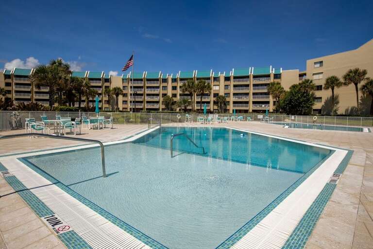 Take a refreshing dip in the sparkling pool just steps from the beach. Relax in the sun, enjoy plenty of seating, and make the most of your beach vacation in this inviting resort-style setting.