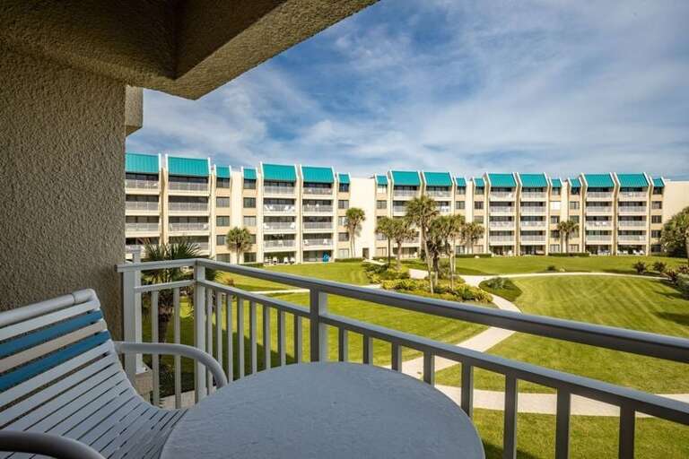 Enjoy your beach stay from this private balcony, perfect for morning coffee or evening relaxation while overlooking lush gardens and resort grounds just steps from the shore. Enjoy your beach stay from this private balcony, perfect for morning coffee or evening relaxation while overlooking lush gardens and resort grounds just steps from the shore.