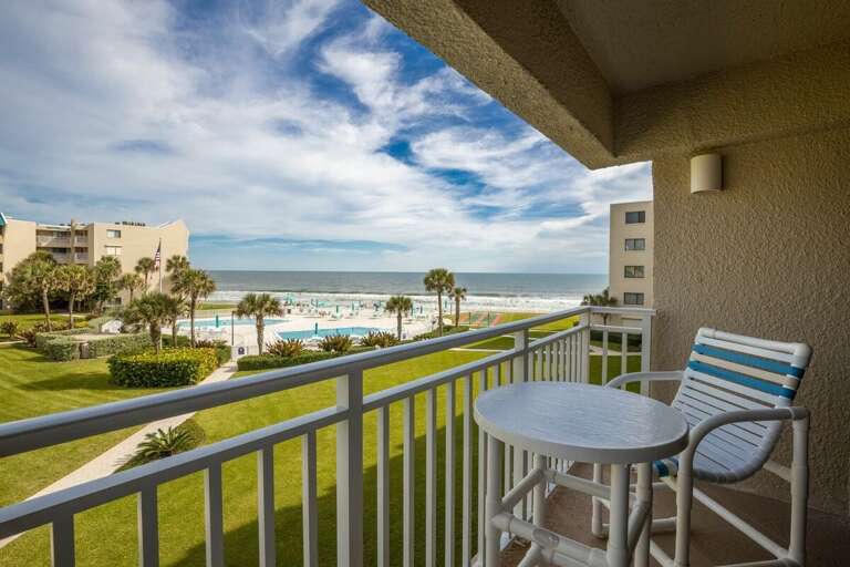 Savor your beach stay on this private oceanfront balcony, perfect for relaxing with a drink while enjoying breathtaking views of the pool, palm trees, and sparkling shoreline. Savor your beach stay on this private oceanfront balcony, perfect for relaxing with a drink while enjoying breathtaking views of the pool, palm trees, and sparkling shoreline.