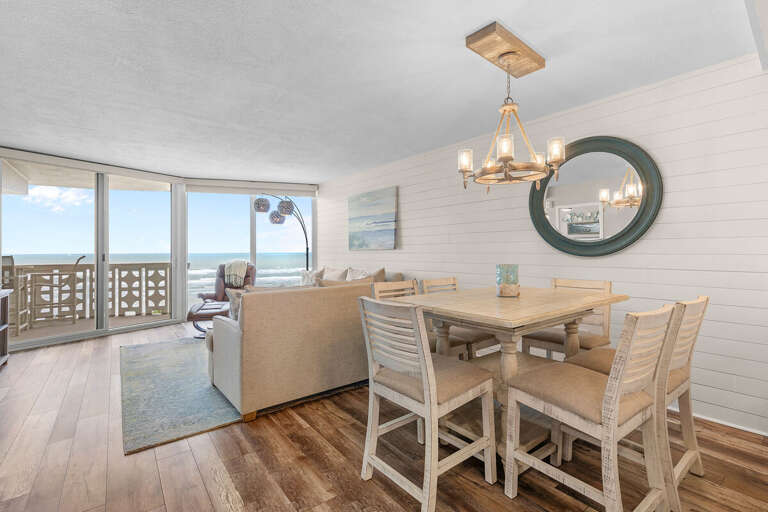 Relax with breathtaking ocean views from this bright beachside dining and living area. Perfect for seaside gatherings, this coastal retreat blends comfort, style, and stunning beachfront scenery. Relax with breathtaking ocean views from this bright beachside dining and living area. Perfect for seaside gatherings, this coastal retreat blends comfort, style, and stunning beachfront scenery.