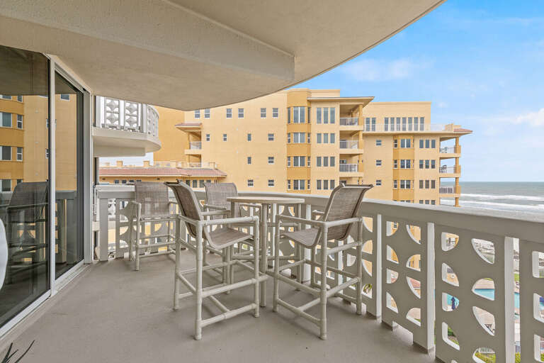 Relax on the private beachfront balcony with comfortable seating and ocean views—perfect for enjoying morning coffee or evening sunsets by the sea.