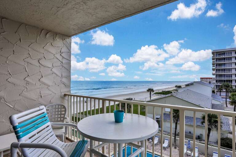 Balcony View Of Beach And Blue Sea, Breezes Blowing, Bright Beneath Sky