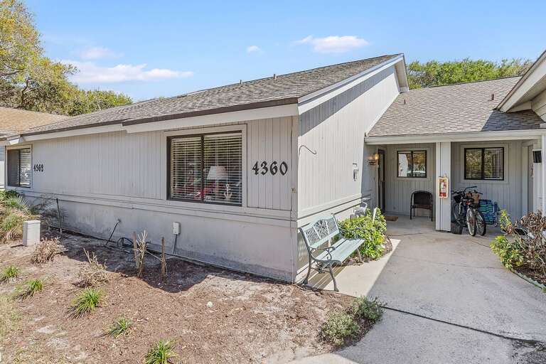 Bright and inviting beach stay condo with private entrance, cozy patio seating, and easy access to