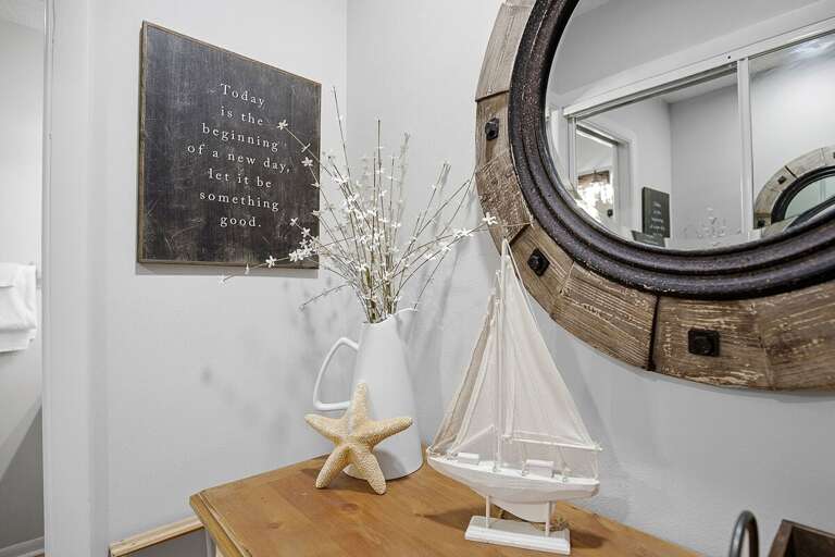 Thoughtfully styled beach stay accents featuring nautical decor, soft textures, and coastal touches. These charming details create a warm, inviting atmosphere for your relaxing beach getaway.