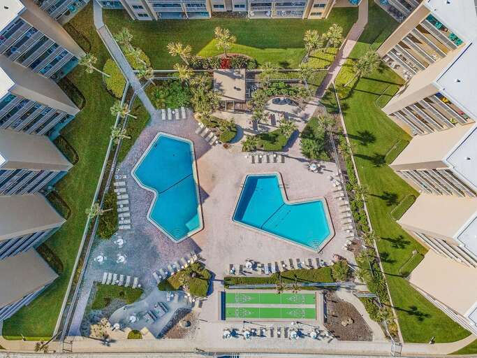Enjoy a fun-filled beach stay with two sparkling pools, spacious sundecks, shuffleboard courts,