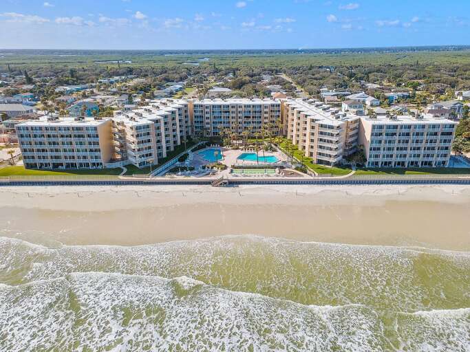 Experience the ultimate beach stay at this oceanfront resort, featuring direct beach access, sparkling pools, spacious sundecks, and a prime location along the sandy shoreline.