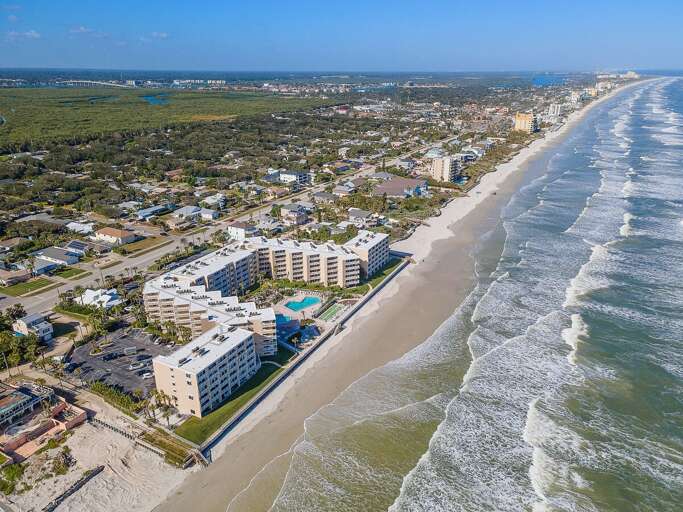 Take in the stunning coastline from above, showcasing this oceanfront resort directly along the