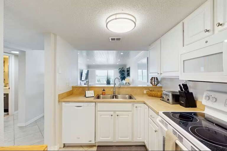 Practical Kitchen, White Cabinetry, Wooden Counters