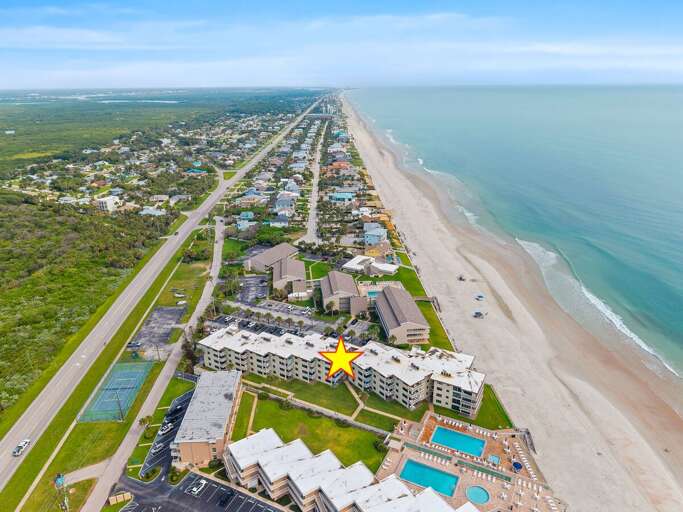 See the resort's unbeatable oceanfront location from above, with miles of sandy beach right outside