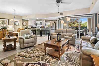 Enjoy seamless indoor-outdoor living in this bright coastal retreat featuring plush seating, a full