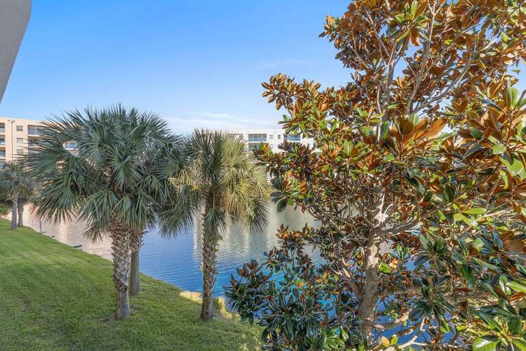 Enjoy serene lagoon views framed by swaying palms and lush greenery. This peaceful outdoor setting enhances your beach stay, offering a tranquil escape just moments from the sand and surf.