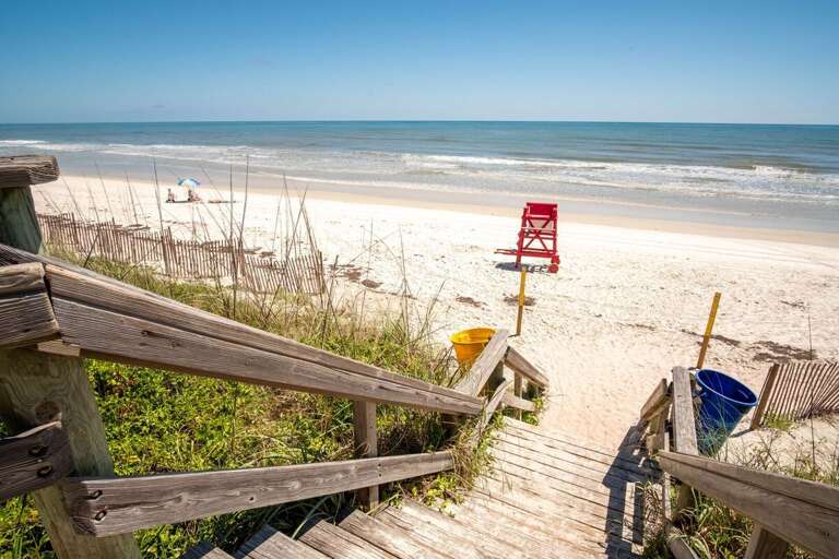 Follow the private boardwalk straight to the sandy shoreline and sparkling ocean views. Just steps