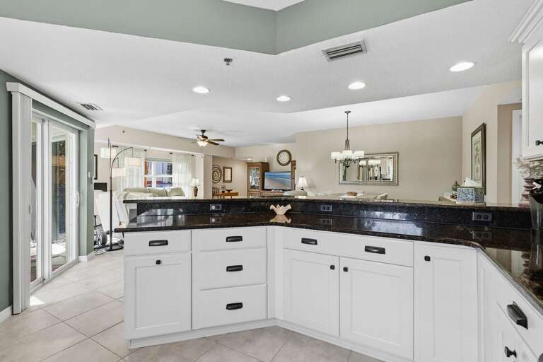 Open-concept kitchen with expansive counters and bar seating, perfect for gathering during your