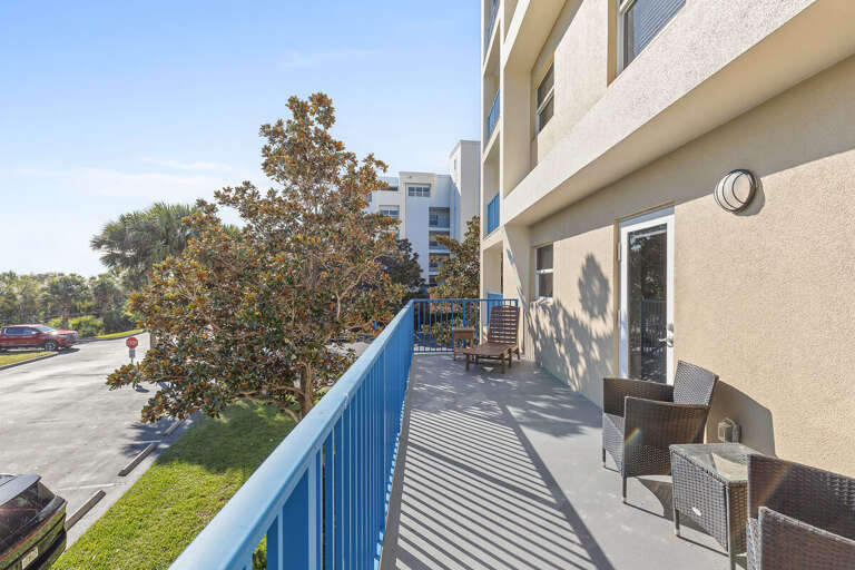 Relax on this spacious private balcony with comfortable seating and sunny coastal vibes. Perfect for morning coffee or evening unwinding, adding extra comfort to your unforgettable beach stay getaway.