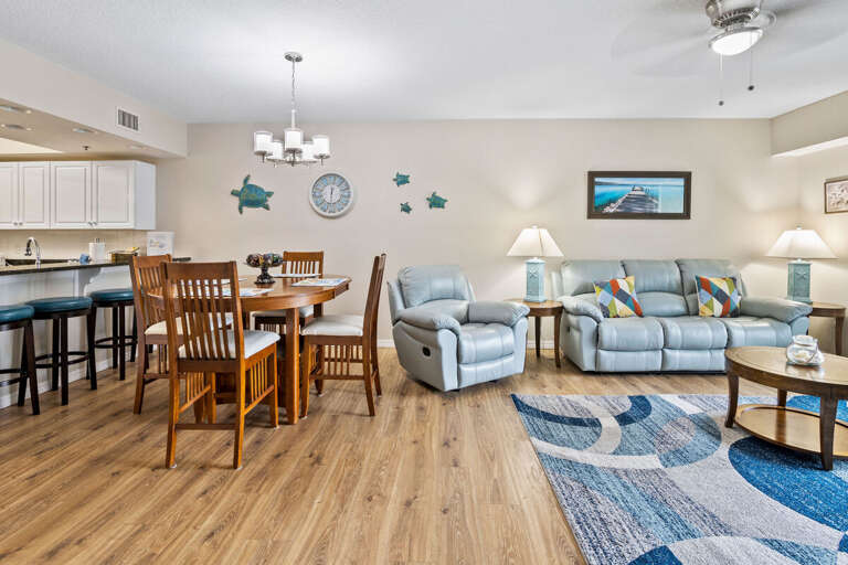 Experience the comfort of this open-concept living and dining area, designed for a relaxing beach